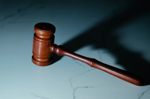 Appeal a denied Italian citizenship application: Photo of a wooden gavel in a marble table