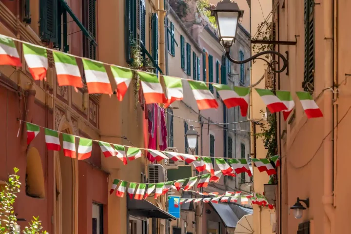 April 25 in Italy: Photo of a street adorned with italian flags to celebrate the Liberation day