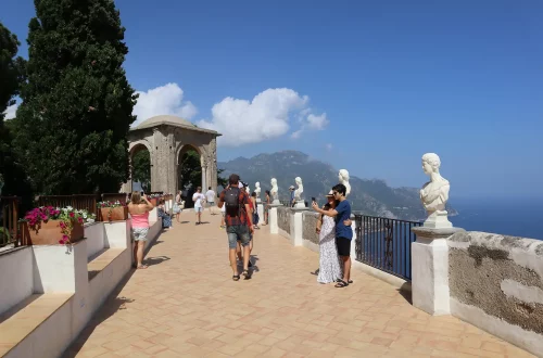 Benefits of becoming an italian citizen: photo of tourists and italians walking on a stone walkway in Amalfi Coast, Italy