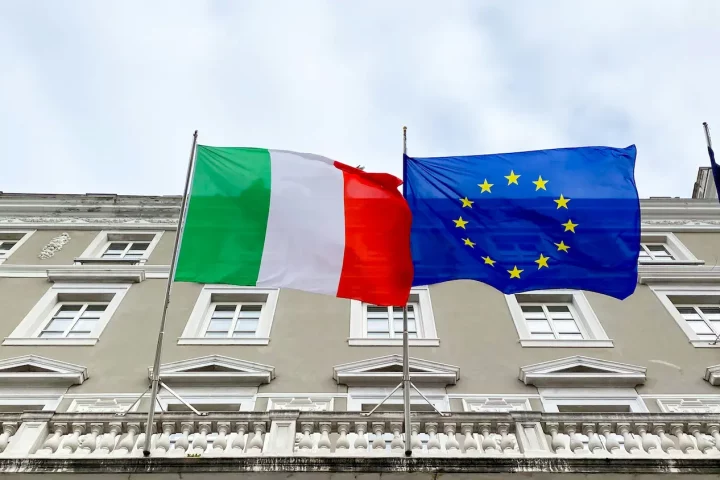 Benefits of joining the EU: Photo of the Italian and EU flags on a building