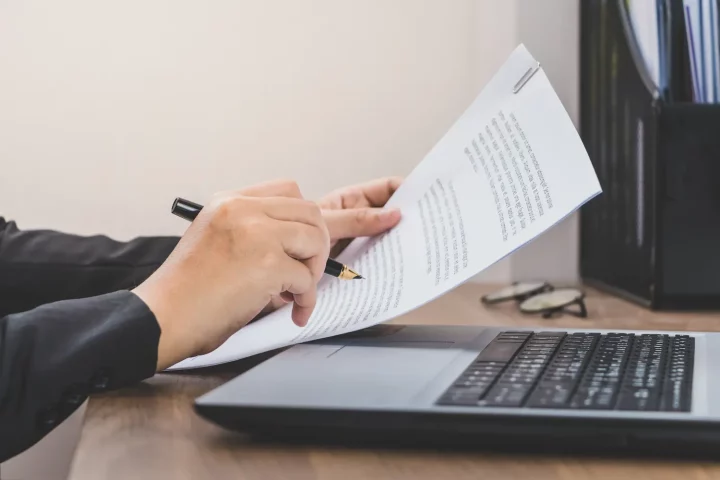 Person holding documents for the certificate of naturalization