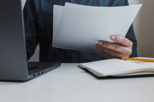 Person holding documents of their Italian citizenship portfolio