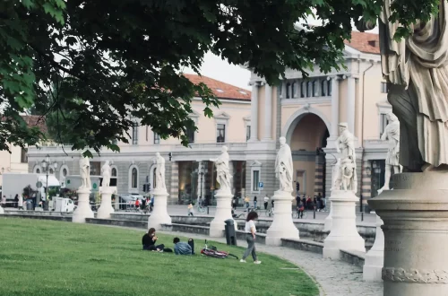 Common mistakes in Italian citizenship applications: Photo of people resting on Prato della Valle square in Padua