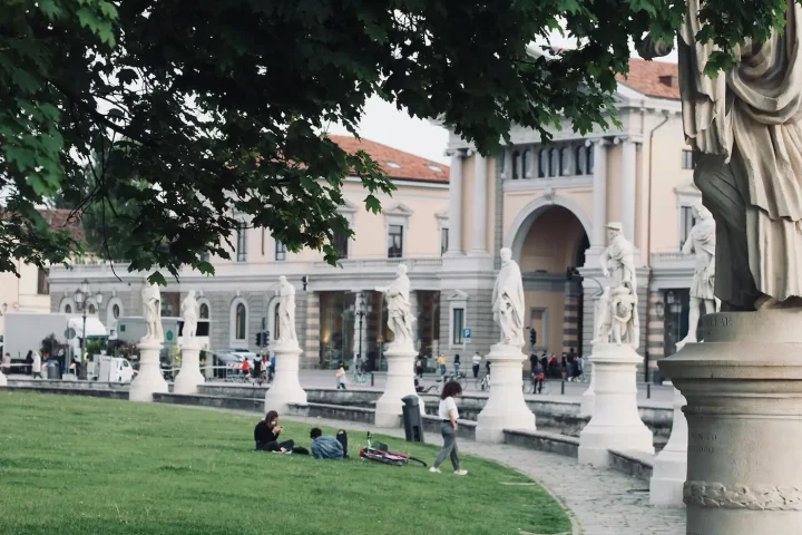 Common mistakes in Italian citizenship applications: Photo of people resting on Prato della Valle square in Padua