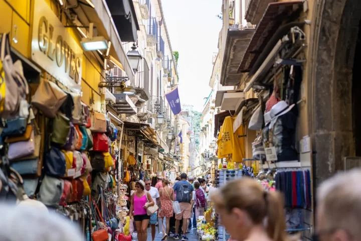 Cost of living in Italy: Photo of people walking around a market in Sorrento, Metropolitan City of Naples.