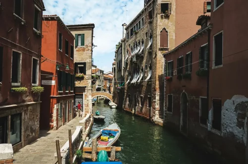 How can I get permanent residency in Italy: Photo of traditional italian houses in the city canals of Venice