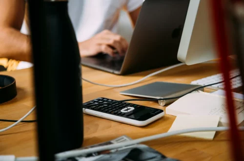 A man searching on his pc the Italian citizenship assistance cost