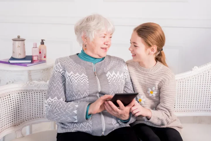 Italian citizenship by descent: great-grandparent and great-granddaughter using a tablet