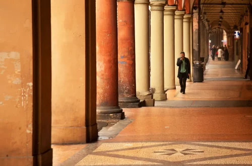 Legal arguments for Italian citizenship by descent under decree-law 36/2025: Photo of man walking through a historical building in Italy