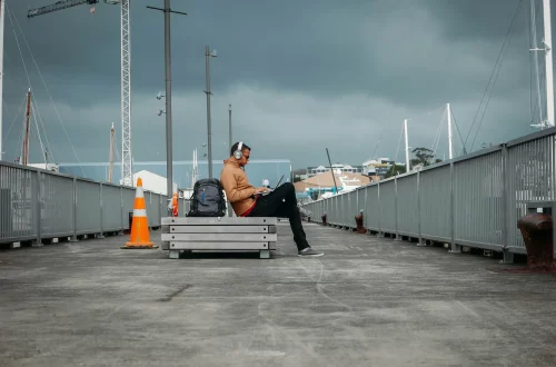 Italian digital nomad visa: Photo of a digital nomad working in a pier