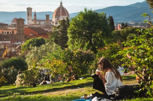 The Italian language: Photo of a woman in florence writing notes in a park