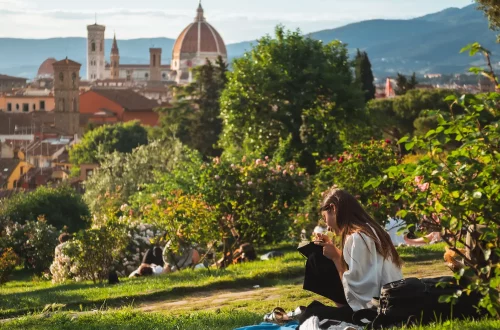 Italian legacy: Photo of people sitting on the grass enjoying a sunny day in Florence