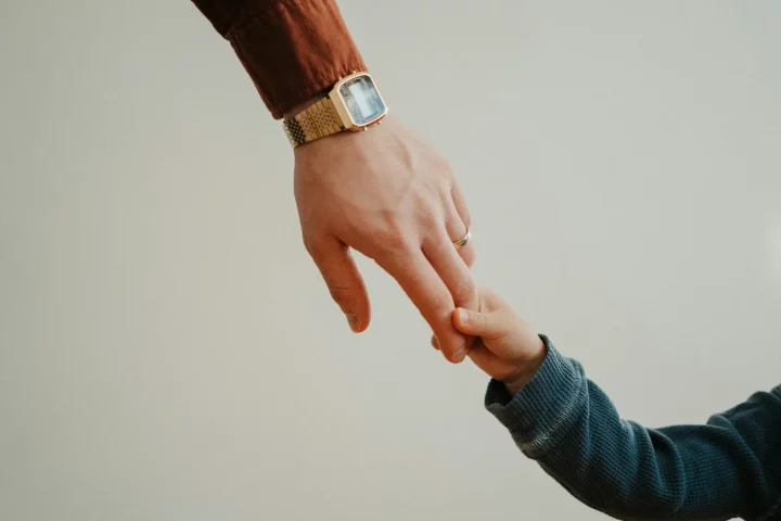 Jus sanguinis citizenship: photo of father and son holding hands, representing the right of blood