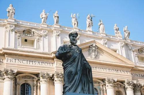 The role of the Catholic Church in shaping Italy’s history, culture, and identity: Close-up of statues in front of St. Peter’s Basilica, Vatican.