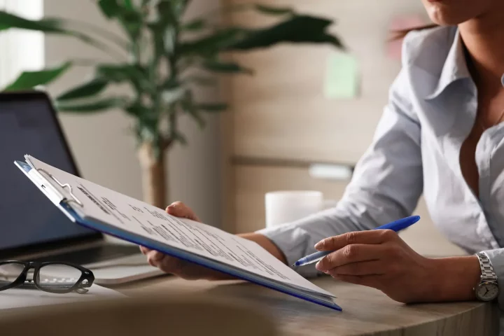 Photo of a woman working on translation of Italian citizenship documents